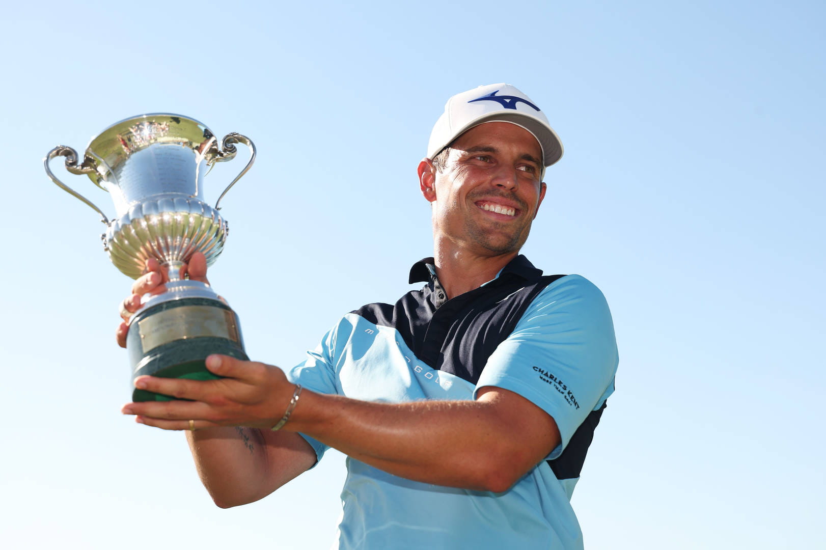 Adrien Saddier celebrates with the Italian Open trophy at Argentario Golf and Wellness Resort in 2025.